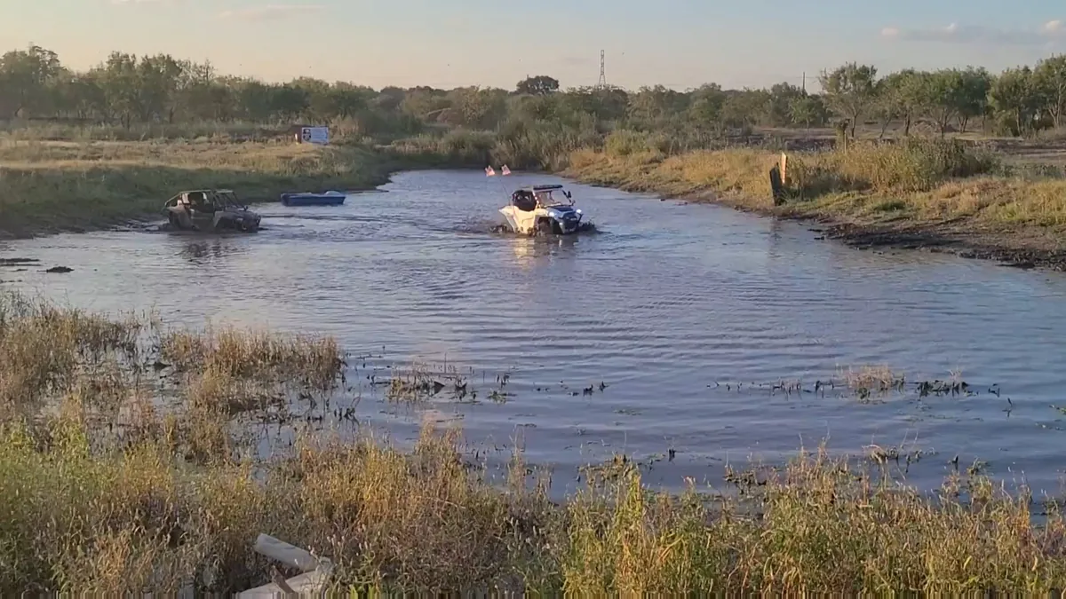 UTVs at 281CC pond crossing golden hour — camping evening