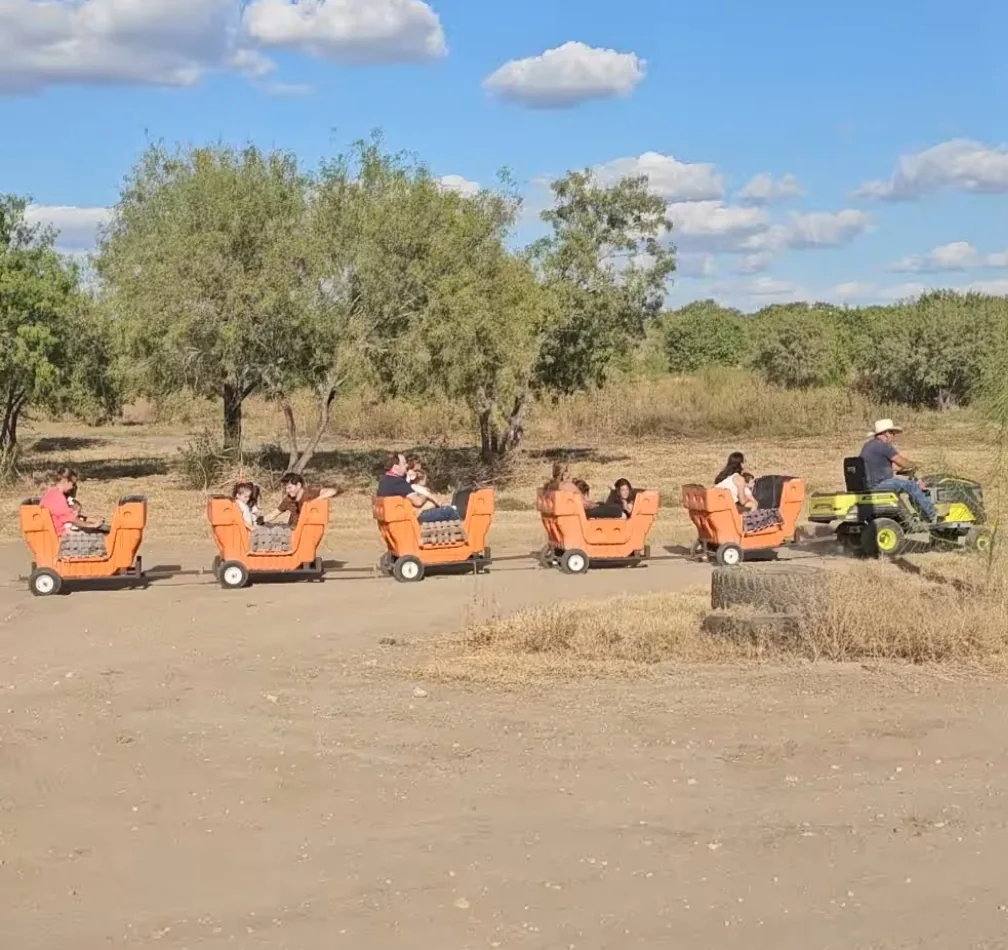 Families riding the kids train carts at 281 Country Club San Antonio TX